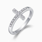 Moissanite cross band ring, angled view showing pavé cross detail and band