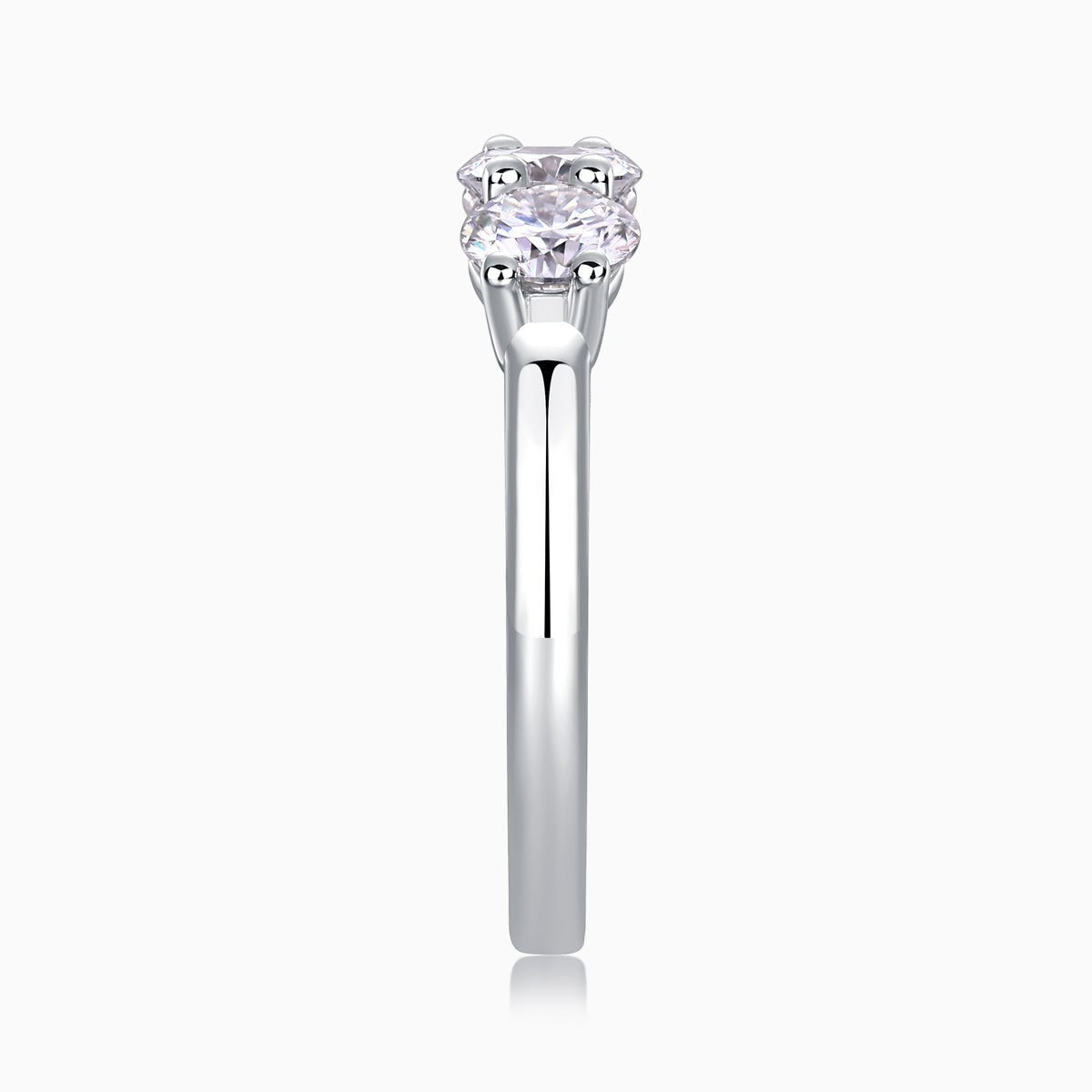 Three-stone moissanite ring with round center stone and matching side stones
