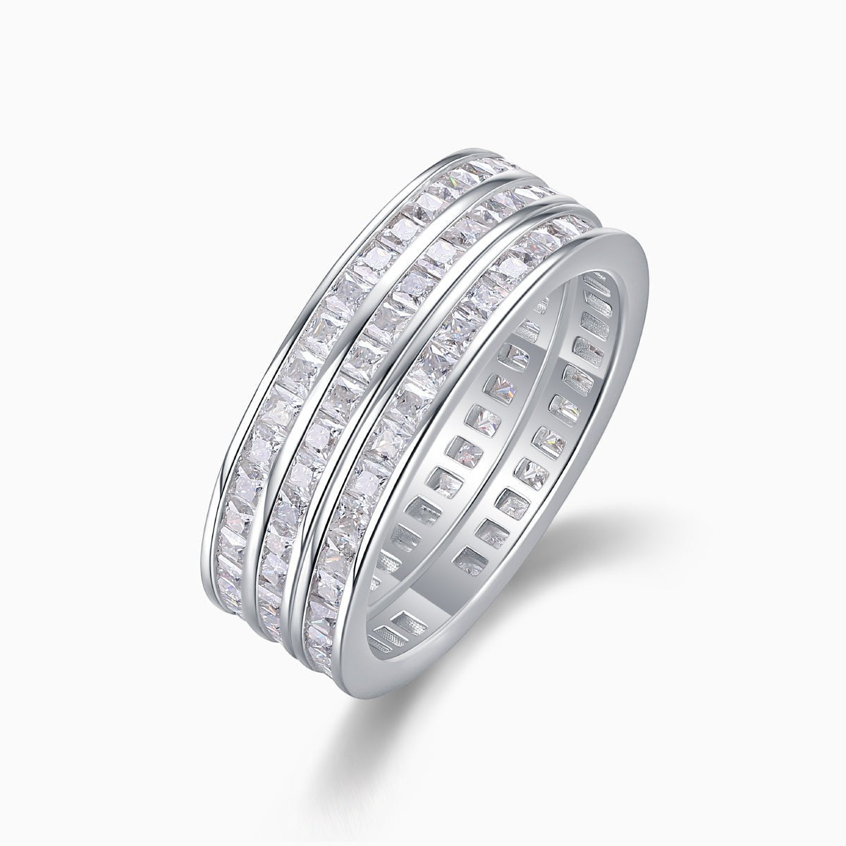 Triple row moissanite wide band ring in white metal, angled side view