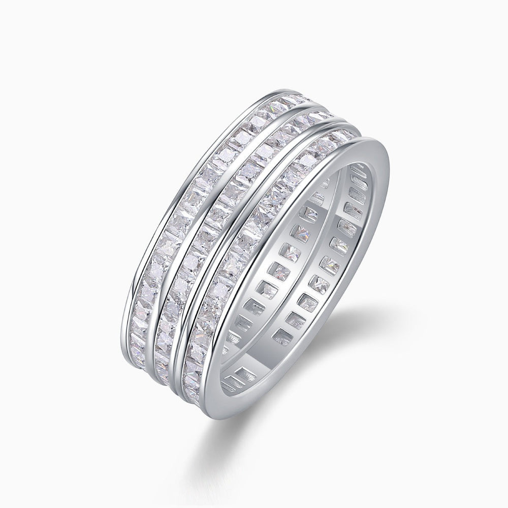 Triple row moissanite wide band ring in white metal, angled side view