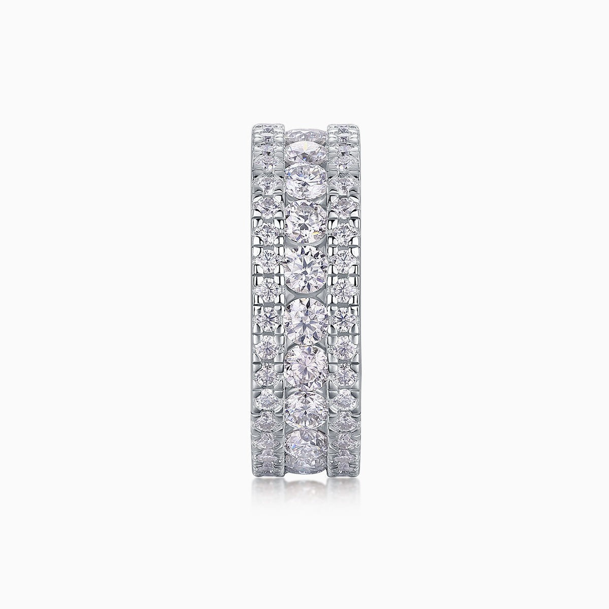 Front view of triple-row pavé moissanite ring, multiple round stones set in white metal