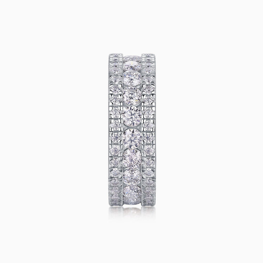 Front view of triple-row pavé moissanite ring, multiple round stones set in white metal