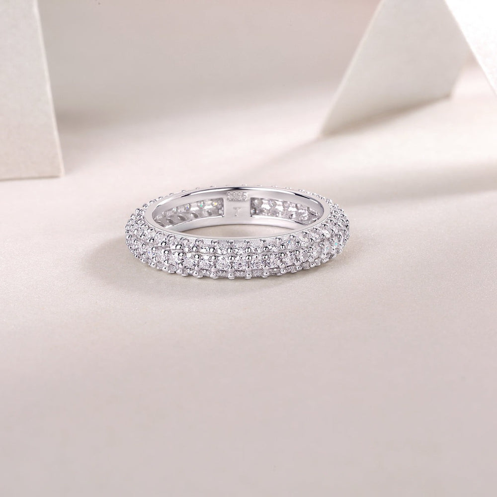 Triple-row pavé moissanite band ring, top view showing inner band detail.