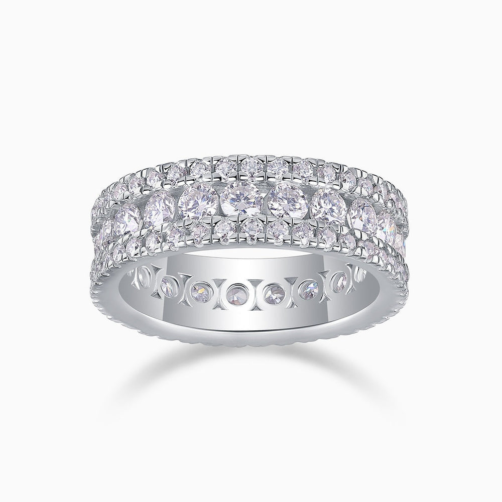 Triple-row pavé moissanite wedding band with three rows of bright round stones, white metal
