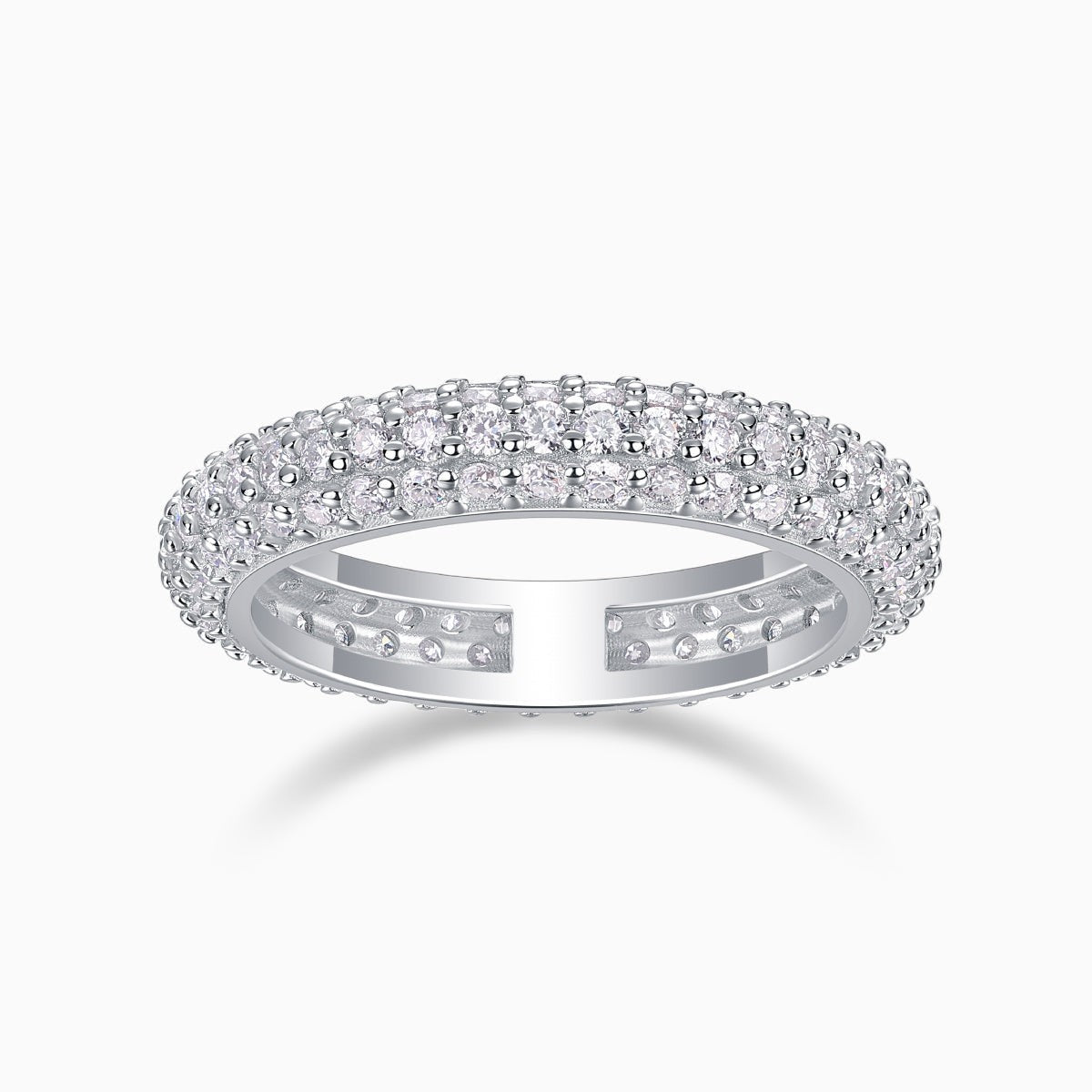 Triple-row pavé moissanite band ring, white gold vermeil, prong-set sparkle profile.